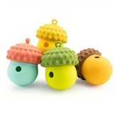Colorful Acorn Wobbler Dog Treat Dispenser Toy for interactive enrichment play.