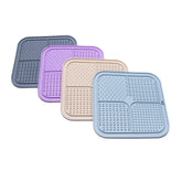 FourZone Slow Feeder Enrichment Mats in assorted pastel colors with four textured zones for slow feeding and licking enrichment.