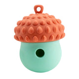 Orange and mint Acorn Wobbler Dog Treat Dispenser Toy with textured top.
