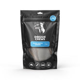 Packaging of Shark Dental Chews for dogs, showing a black background with a transparent window revealing the chews inside. The brand 'Doggie Chews' is visible on the packaging along with the product name and other details.