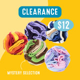 Colorful dog enrichment snuffle balls with a 'Clearance' label and price on a yellow background