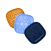 Wave Ripple Slow Feeder Bowls in mustard, blue, and navy designed with curved ridges to promote slow feeding for dogs