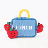 ZippyPaws Lunchbox Burrow Dog Toy with squeaky red apple plushies for interactive play.