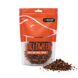 Packaging of Grave Dirt Halloween dog meal topper from The Treatery, with dark baked cookie crumble displayed in front.