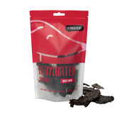 Packaging of The Treatery dehydrated beef liver dog treats with visible treats outside the package.