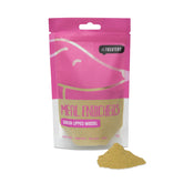 A pink packaged product labeled 'Green Lipped Mussel Enricher Protein' by The Treatery, with a small pile of yellow powder, presumably the protein supplement, in front of the package.