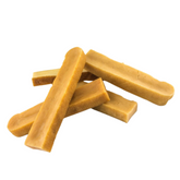 An image of several Himalayan Dental Chews for dogs, which are long, thin, and appear to be made of a natural, yellowish substance.