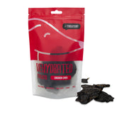 Packaging of dehydrated chicken liver dog treats. The package is red with a picture of the treats and some treats are displayed in front of the package.