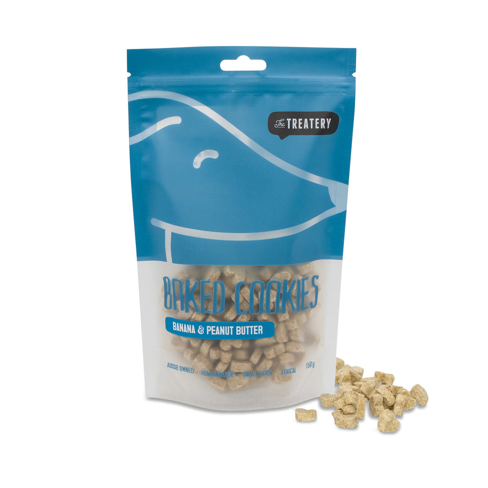A package of The Treatery's Banana & Peanut Butter dog cookies with several cookies displayed in front.