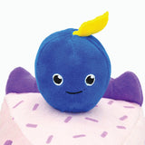Close-up of HugSmart Blueberry Cake Dog Toy featuring smiling blueberry plush topper.
