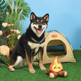 Dog sitting beside HugSmart Fuzzy Friendz Campfire Plush Dog Toy, adorable campfire play toy.