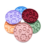 Flower Power Slow Feeder Enrichment Bowls in assorted pastel colors designed to promote slow eating and mental stimulation in dogs.