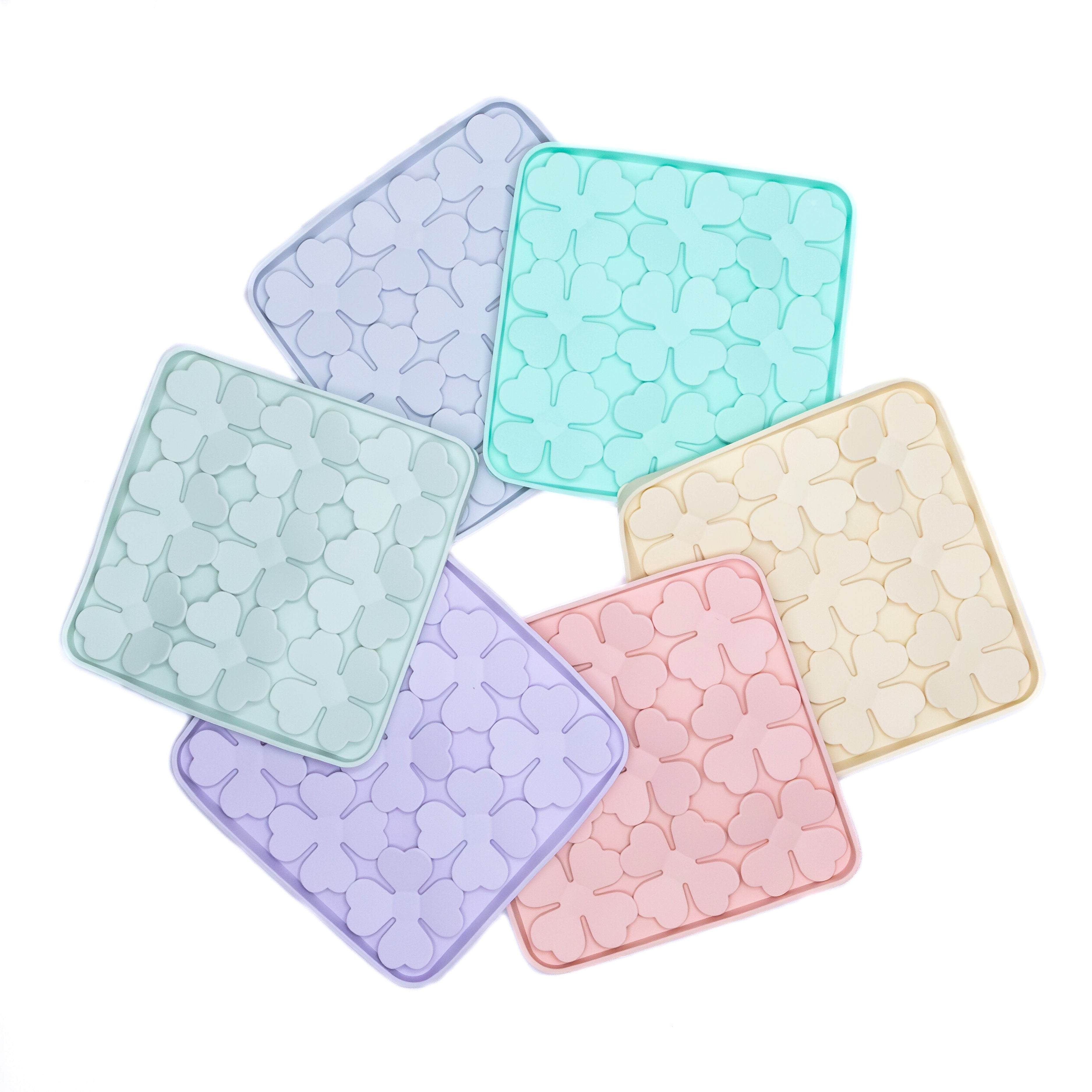 Flowers Slow Feeder Enrichment Bowls in assorted pastel colors designed to promote slow feeding and reduce anxiety in dogs.