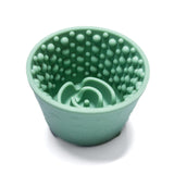 Green Cosmic Lick Bowl Treat Cup for dogs with raised texture for mental stimulation.