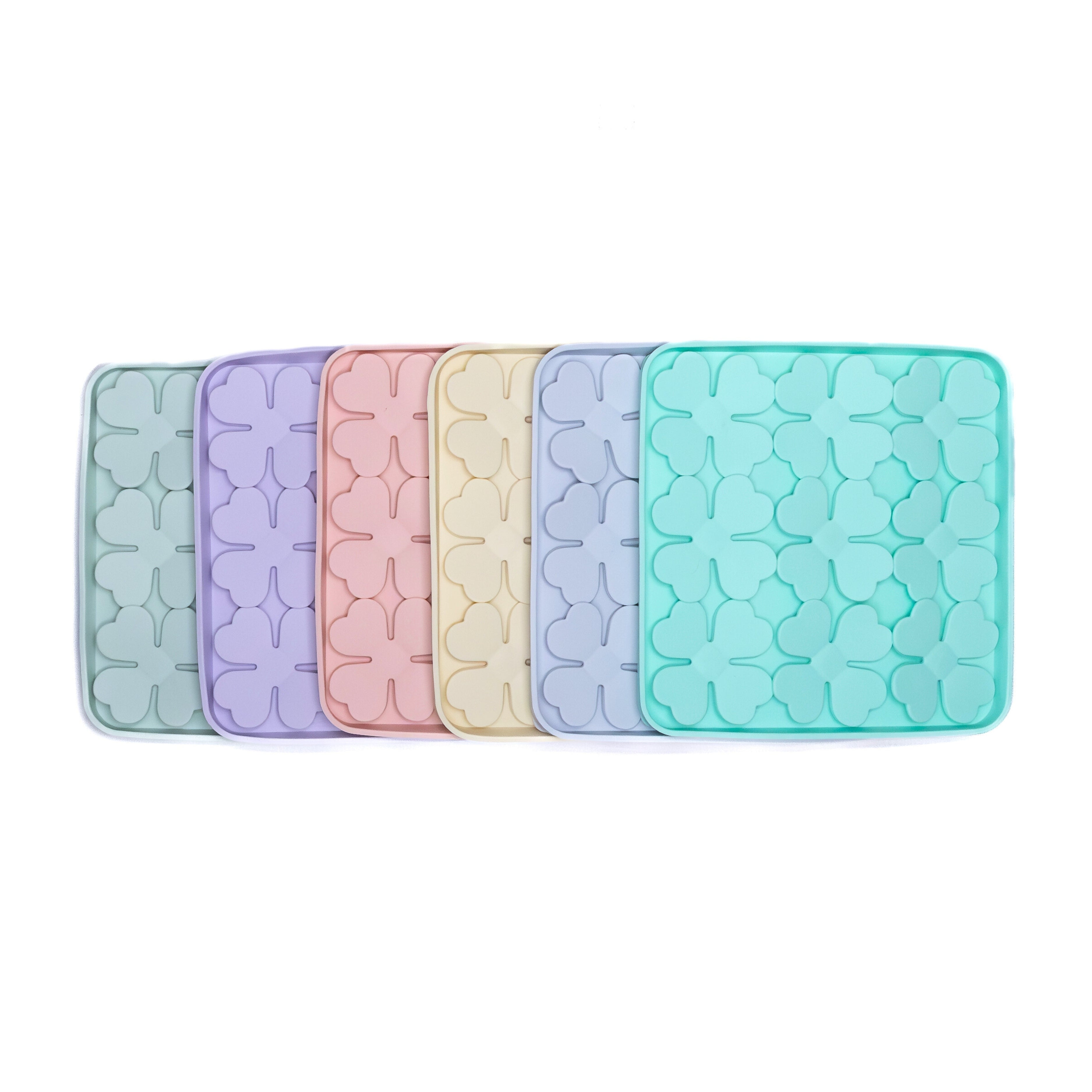 Lineup of pastel-colored Flower Slow Feeder Enrichment Bowls designed to promote healthy eating habits for dogs.