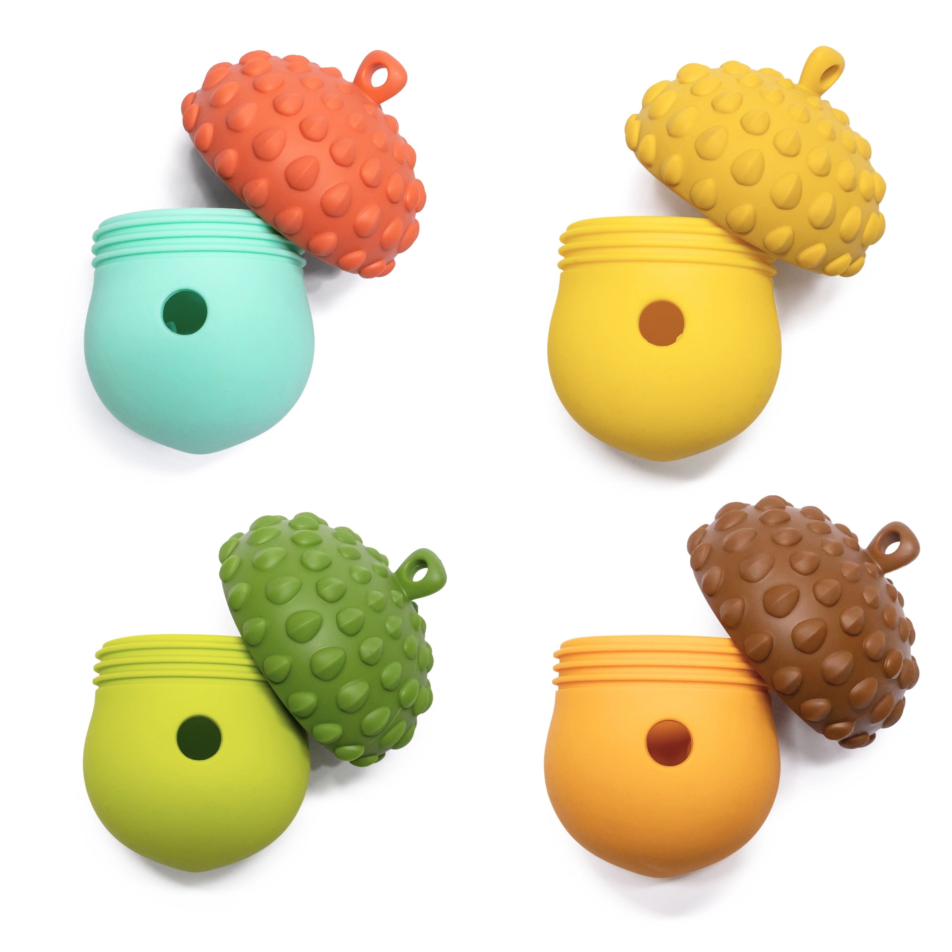 Open Acorn Wobbler Treat Dispenser showing four colors for mental stimulation play.
