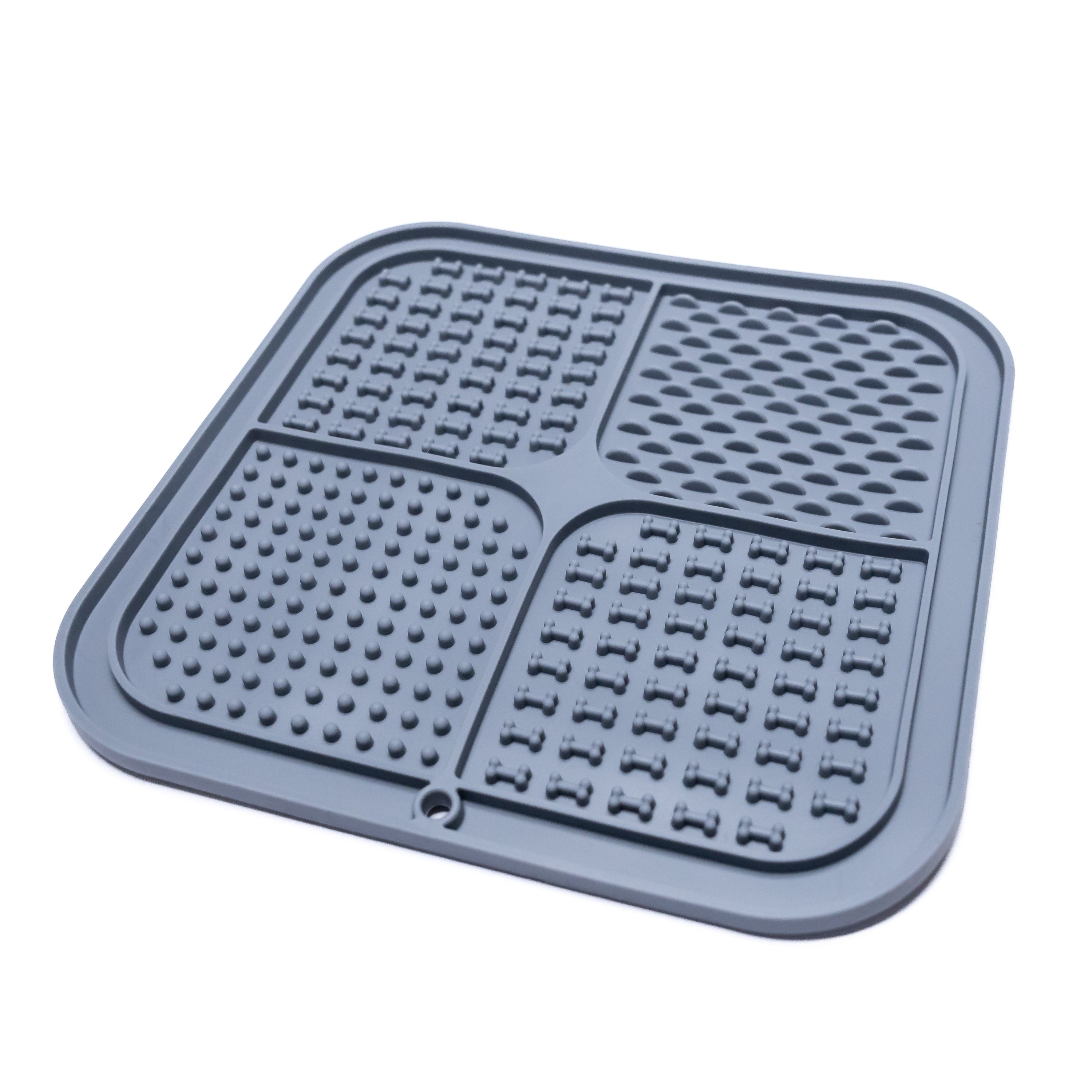 Side view of dark gray FourZone Slow Feeder Enrichment Mat showing textured design for lick mat enrichment and anxiety relief.
