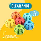 Colorful dog toy balls with clearance label on a yellow background