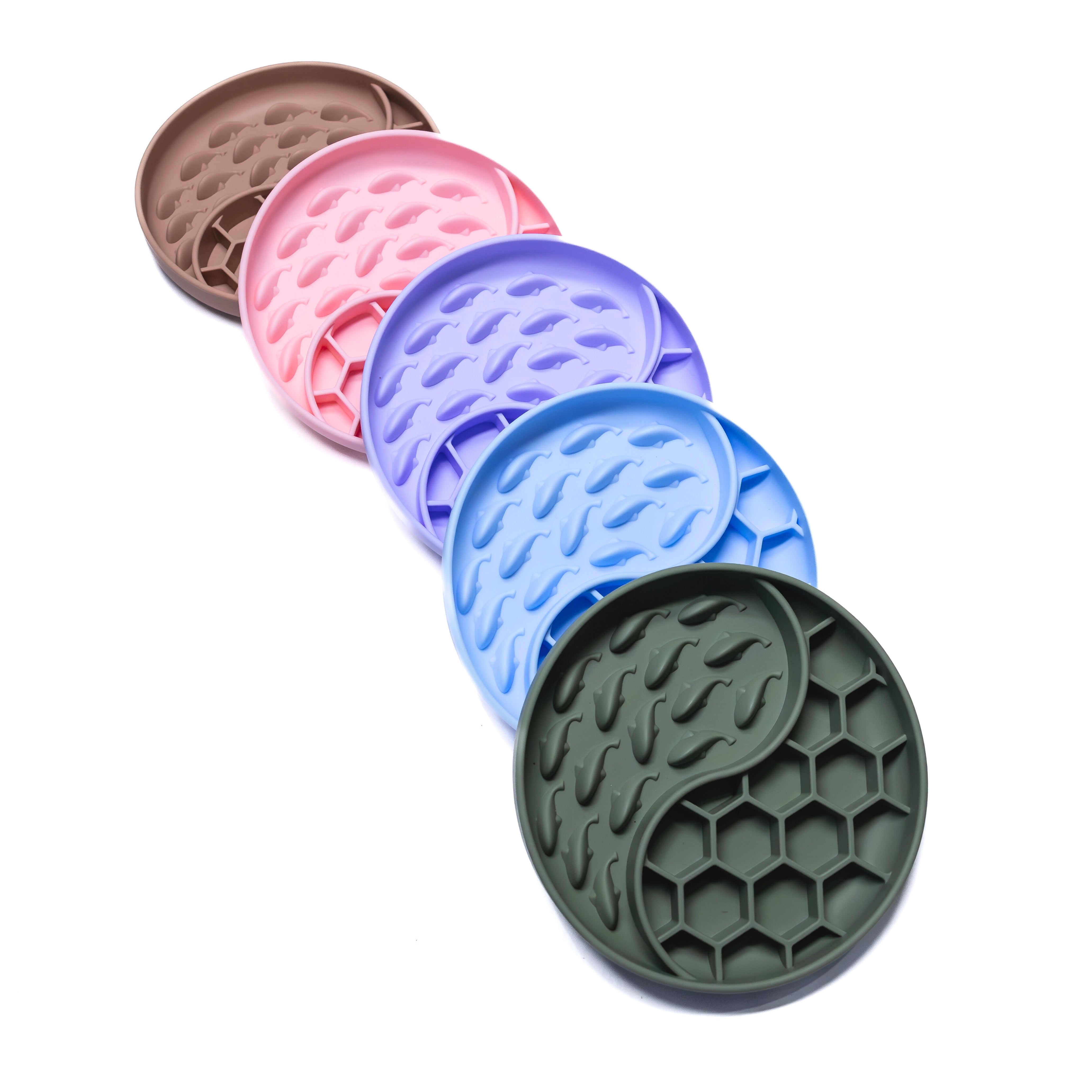 Whale Wave Slow Feeder Bowls in green, pink, blue, purple, and brown colors designed for interactive and calm feeding.